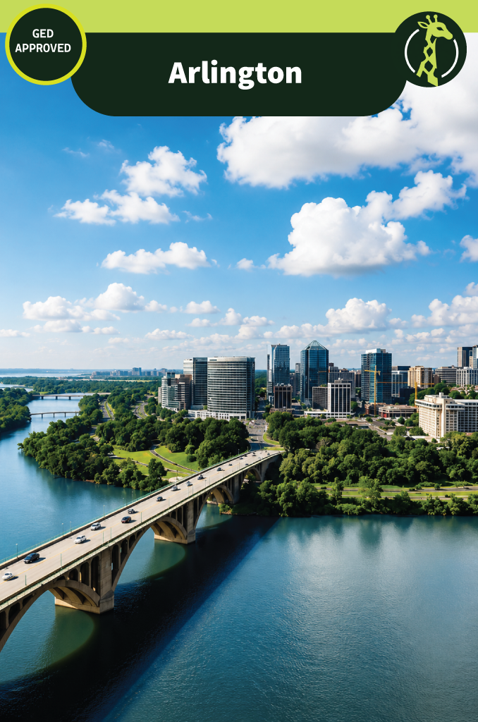 The Rosslyn skyline in Arlington, Virginia seen across the Potomac River on a clear day, with a long arched bridge carrying traffic toward the city and wooded parkland along the far bank.