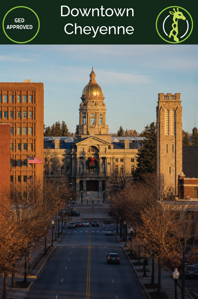The Wyoming State Capitol dome in downtown Cheyenne under a wide blue sky.